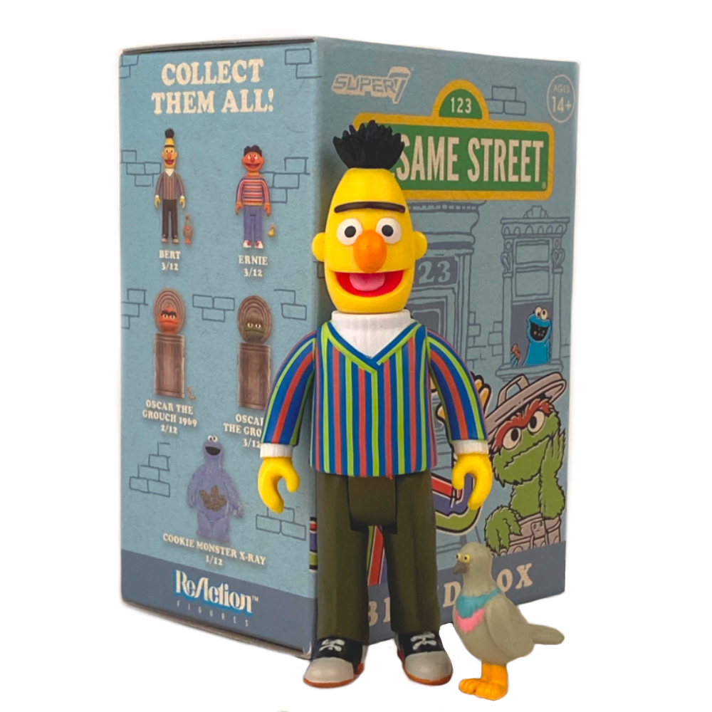 A Bert figurine from Sesame Street stands next to a smaller pigeon figure, with the packaging in the background showcasing various ReAction Figures from the Sesame Street Series 1 Super 7 Blind Box by Super 7 (US), adding to the allure of these collectible toys.