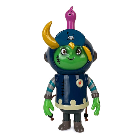 The Hero P-Man — Zombie by How2Work (HK) is a colorful toy figure featuring a green face, yellow horn, blue helmet, striped arms, and a pink creature on its head. It wears a navy outfit adorned with a skull emblem.