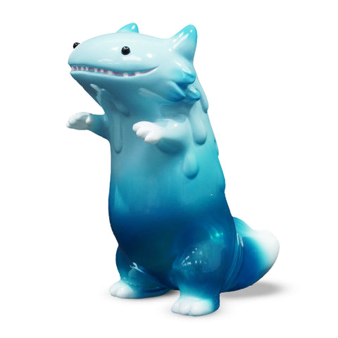 The Byron — Blue Fade by The Little Hut (HK) is a shark-like figure with small arms, an upright posture, and a friendly expression.