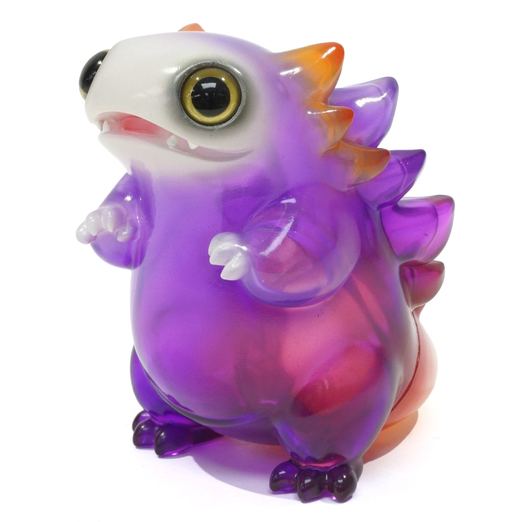 The Little Hut (HK)'s Tokke — Ametrine is a translucent toy figure featuring a dinosaur-like creature with large eyes, small limbs, and purple and orange colors.