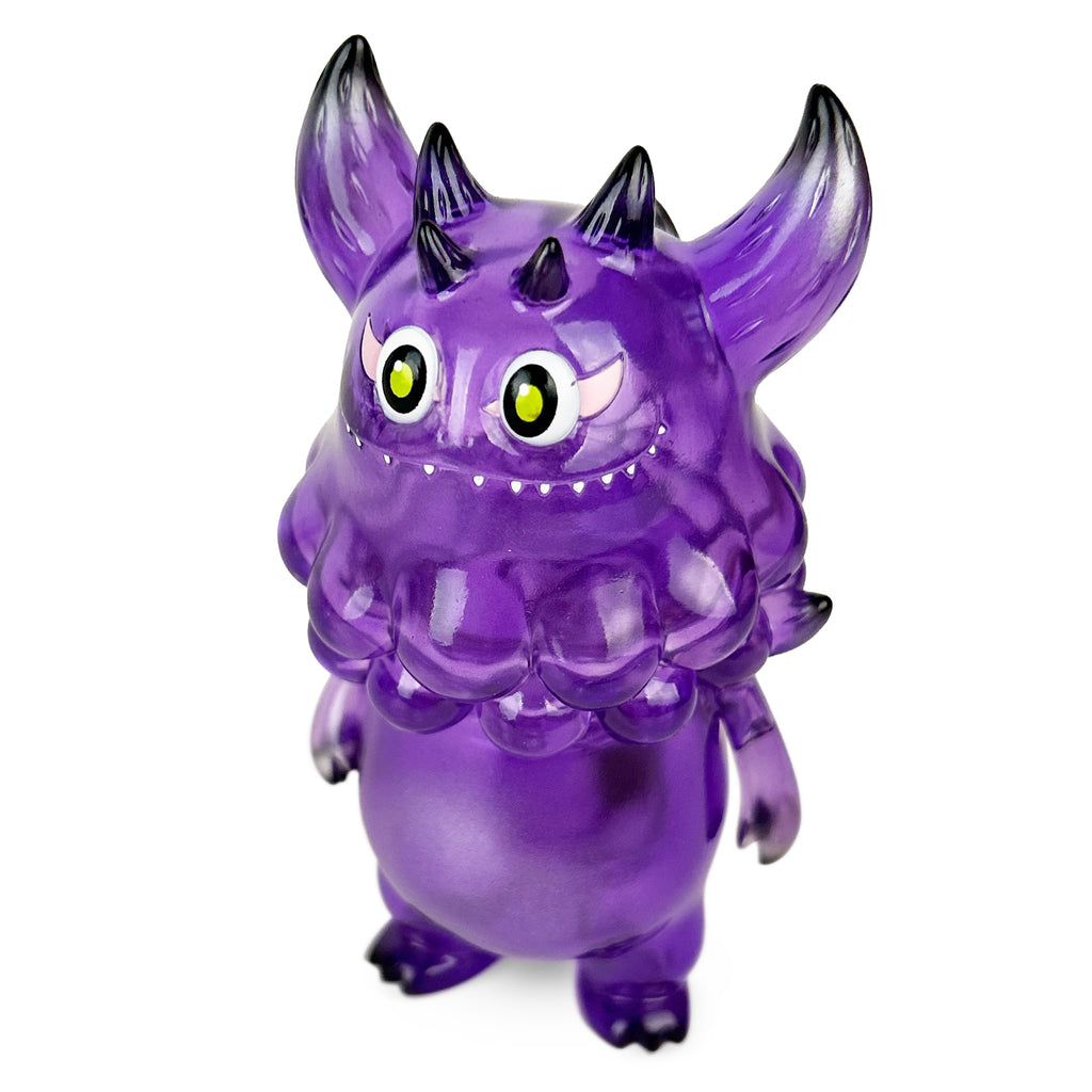 The Little Hut (HK)'s Rangeas Jr. — Clear Purple is a small, translucent toy monster with pointy ears, horns, and yellow eyes standing on a white background.