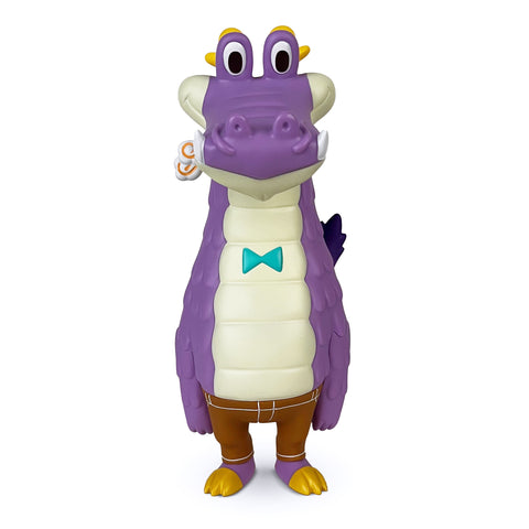 Draco — Purple by How2Work (HK) is a cheerful purple cartoon alligator figure with a wide grin, big eyes, and a blue bow tie. It stands upright wearing brown pants and has yellow feet.