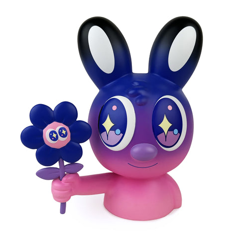 A vibrant cartoon character with large eyes and bunny ears, similar to the limited edition Twilight figure from Blake Jones' Flower Picker series by UVD Toys (US), holds a flower with a face.