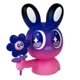 The limited edition Blake Jones' Flower Picker — Twilight by UVD Toys (US) showcases a pink and purple cartoon-like character with large eyes holding a blue and purple flower. Complete with charming bunny-like ears, it's a whimsical addition to any collection.