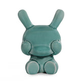 A blue mist crackle glaze Kidrobot Three Wise Dunnys 5” Porcelain figurine sits with large ears and a round head against a white background, part of the collectible Dunny 3-Pack from Kidrobot (US).