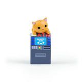 A small orange cartoon cat from the 100% Soft Bodega Kitties — Series 1 Blind Box sits atop a toy ATM with a $0.00 balance displayed on the screen.