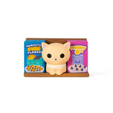 A Bodega Kitties — Series 2 Blind Box cat figurine from 100% Soft sits between two colorful cereal boxes labeled 