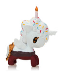 The Tokidoki Ice Cream Shop Unicorno Blind Box features a whimsical cupcake-inspired figure with a white body, colorful sprinkle spots, candle horn, golden wings, and red legs—perfect for fans of Tokidoki's cute collectible toys.