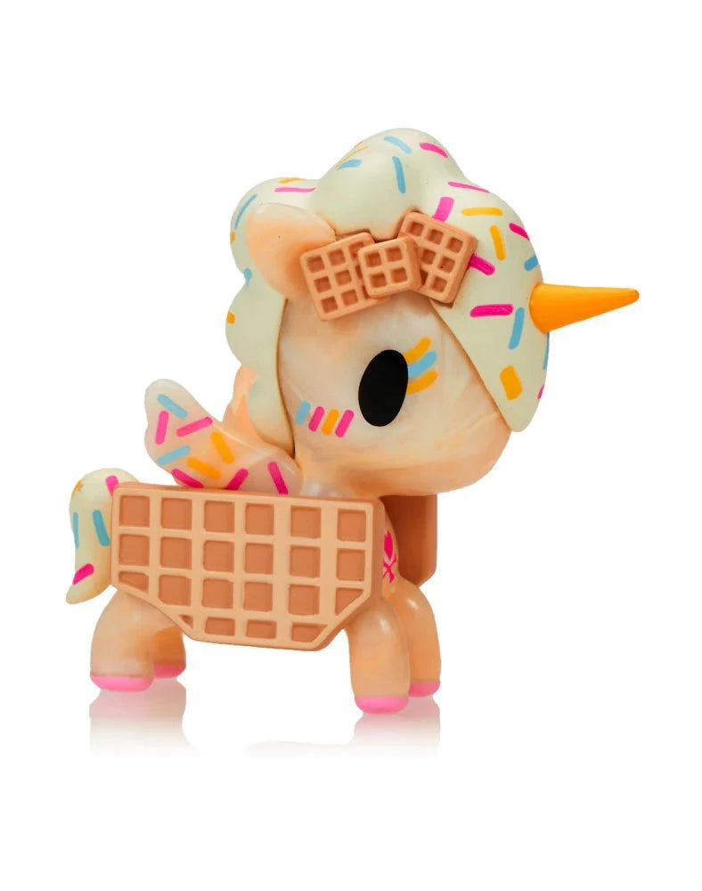 The Tokidoki Ice Cream Shop Unicorno Blind Box features a small figure with a waffle-textured body, ice cream accents, sprinkles, and a yellow horn—perfect for any Tokidoki fan or Unicorno collector.