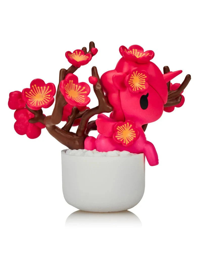 The Tokidoki Botanical Harmony Unicorno Blind Box features a pink Unicorno with cherry blossoms in a white pot, blending nature and charm. From Tokidoki’s collectibles, it’s a delightful addition to any collection.