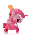 The Tokidoki Ice Cream Shop Unicorno Blind Box features a whimsical pink unicorn toy with wings, an ice cream popsicle stick on its head, and drizzled details—perfect for collectors who love cute Tokidoki surprises.