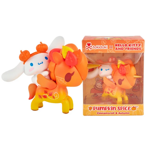A Tokidoki x Hello Kitty and Friends Pumpkin Spice Cinnamoroll & Autumn Special Edition collectible by tokidoki features a white character riding an orange unicorn adorned with autumn leaves, displayed beside its themed box. This charming special edition highlights a whimsical pumpkin-inspired design.