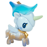 Introducing the Forest Fairy Calla Lily Special Edition Unicorno Keychain by tokidoki—a pastel blue unicorn from the Forest Fairies Collection. This adorable, cartoonish keychain features a light green horn, blue hat, golden necklace, and star patterns decorating its body. Inspired by fairies, the design includes a small wing and large eye with sparkling stars for extra charm.