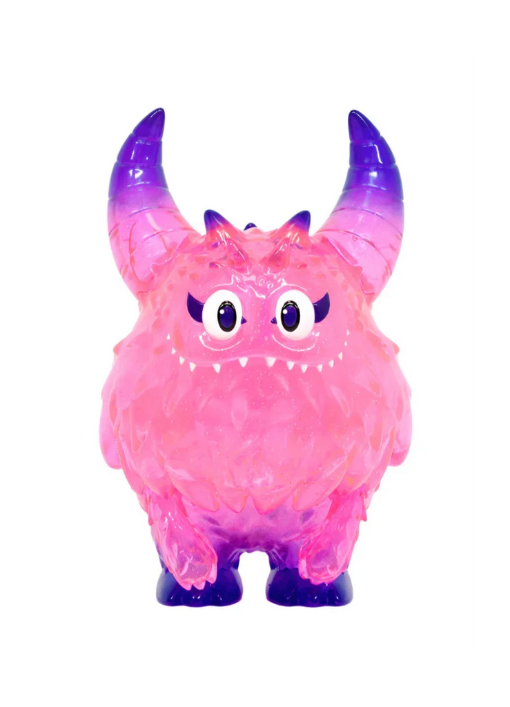 The Little Hut (HK) Rangeas Rex Jr. — Clear Pink is a collectible toy monster with large horns, big eyes, small fangs, and a bumpy clear pink texture, shown standing against a white background.