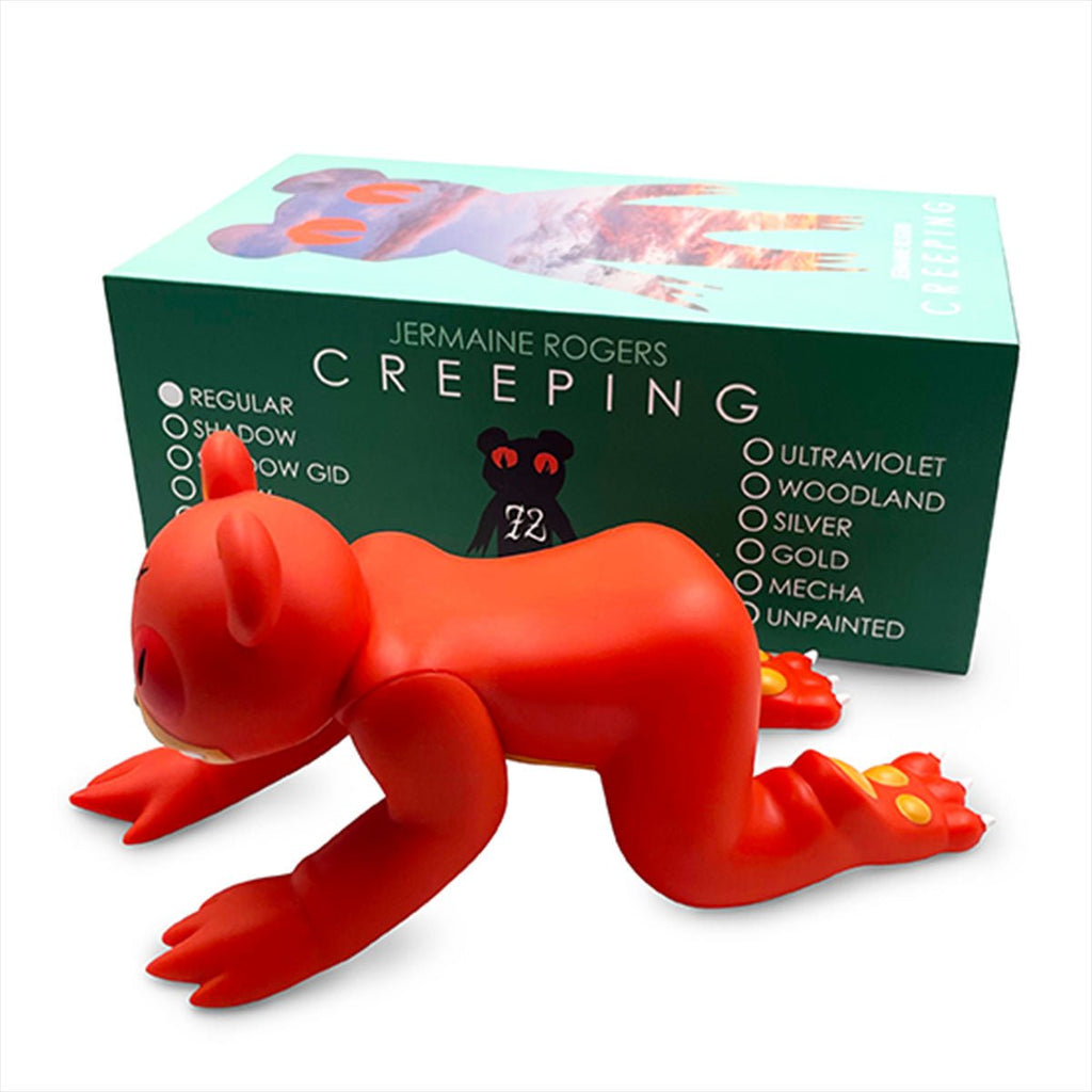 A red vinyl figure bear in front of a box. 
Product: Creeping Dero — Original
Brand: Jermaine Rogers (US)