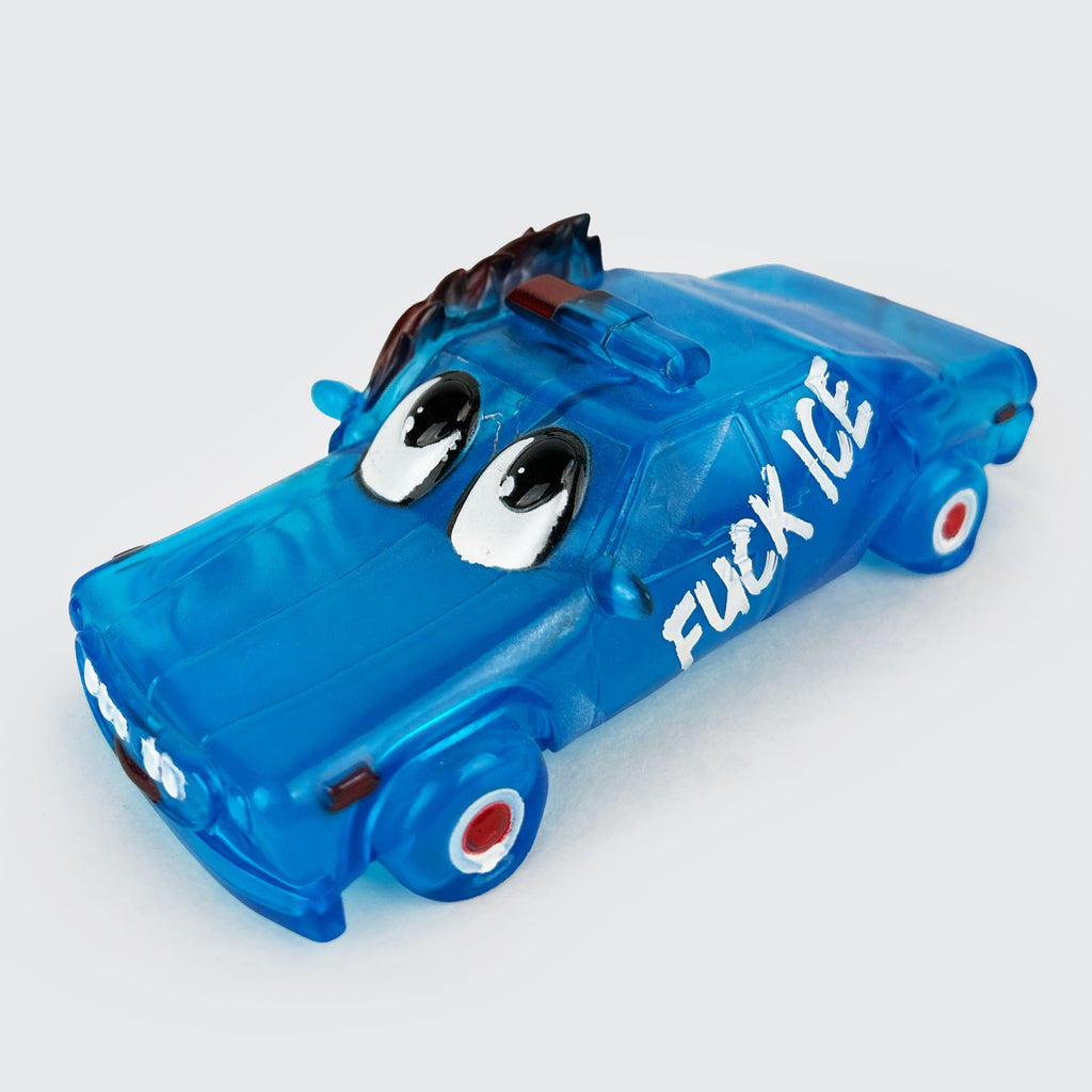 This toy blue car, featuring cartoon eyes with 