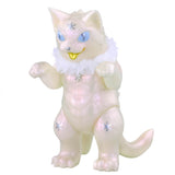 A white translucent cat-like figurine with a fluffy collar, raised front paws, and blue star-patterned eyes, reminiscent of Daioh Negora. Product: Daioh Negora — Snow Pearl by Konatsuya (JP).