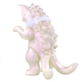 The Daioh Negora — Snow Pearl by Konatsuya (JP) is a pale white, shiny creature with scales and a long tail standing upright. It has a fluffy white collar that hints at its kitty monster identity, resonating with the playful style of Japanese artist Konatsu.