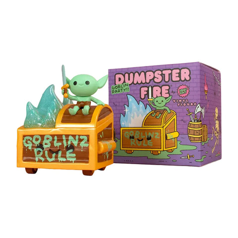 Inspired by Wizard of Barge, the 100% Soft Dumpster Fire Vinyl Figure features a green goblin with a sword in a flaming dumpster labeled "GOBLINZ RULE," next to a colorful box marked "DUMPSTER FIRE.