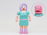Paradise Toy About Animals Michiko/Dinosaur — Series 3: Doll in green dress with purple hair and bow, featuring a removable mask that reveals a pink, monster-like face, plus a cute dinosaur plush friend for imaginative play.