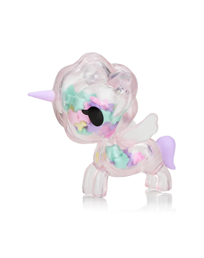 The Toki Mochi Donut Unicorno Sprinkle Star Special Edition by Tokidoki showcases a transparent design filled with pastel sprinkles, complemented by its striking purple horn and wings.