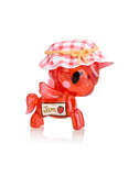 A delightful addition from Tokidoki, this small red Toki Mochi Donut Unicorno Blind Bag figurine features a quirky jar lid hat and a playful 