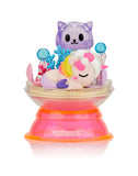 A Tokidoki Dreaming Unicorno Blind Box, part of the tokidoki series, featuring a mermaid unicorn lying on her side with a purple cat and coral in a clear dome, mounted on a pink and orange base—a true piece of magical adventure.