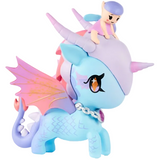 A pastel blue and purple tokidoki Mystical Dragon Unicorno - Fairy Dragon (Special Edition) toy with wings and a jeweled necklace, featuring a small purple-haired Dragon Fairy figure riding on its head. This enchanting collectible is perfect for magical adventures.