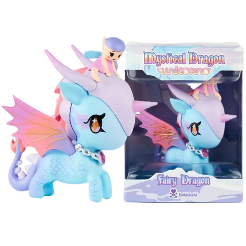 A pastel blue and purple dragon figurine with pink wings and a small fairy rider is displayed beside its box labeled “Mystical Dragon Unicorno - Fairy Dragon (Special Edition)” by tokidoki. This Special Edition piece perfectly embodies the whimsical charm of tokidoki’s Mystical Dragon Unicorno collection.