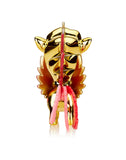 The Tokidoki Lucky Unicorno Fuego Limited Edition, with its golden winged bull design adorned in pink and red accents, captures the mythical elegance of a Unicorno from a front-facing view.