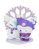 Two figurines dressed in purple, adorned with snow-themed accessories, stand before a large snowflake decoration, perfectly capturing the enchanting spirit of the Tokidoki x Hello Kitty and Friends Winter Dreams Blind Box.