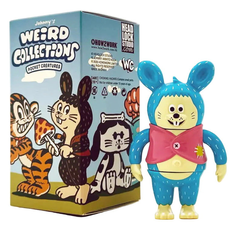 A toy figure in a blue animal costume with a pink scarf stands beside a How2Work Johnny's Weird Collection Pocket Creatures Blind Box, featuring cartoon animals with designs by Johnny Akihito Noda.