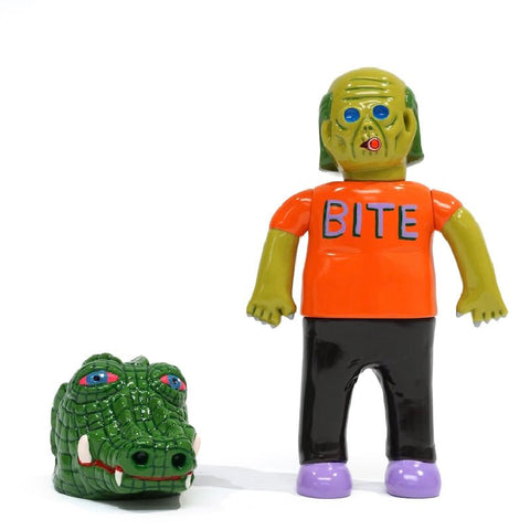 A green zombie figurine with an orange shirt labeled "BITE" and black pants stands beside a Paradise Toy (TW) About Animals Kembuyama Kumabee — Crocodile 1st Version model with pink eyes and white teeth.