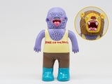 The Paradise Toy About Animals Shishizuka/Lion (Series 3) vinyl features a purple figure in blue boots, brown pants, yellow “King of the Beasts” tank top, plus an alternate lion head accessory (shown in inset).