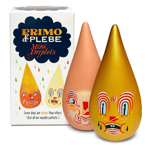 A box labeled "Mini Driplets — Primo & Plebe Blind Box" with two teardrop-shaped figurines by artist Travis Lampe displaying expressive faces in front. One figurine is peach-colored, and the other is gold. Box reads, "Some drips are shinier than others." Brand Name: Squibbles Ink + Rotofugi (US).