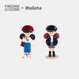 Two cartoon-style figurines from the Molinta Retro Girls Blind Box by Finding Unicorn—one in a red beret and blue skirt, the other in a navy cap and shorts—stand side by side on a plain background.