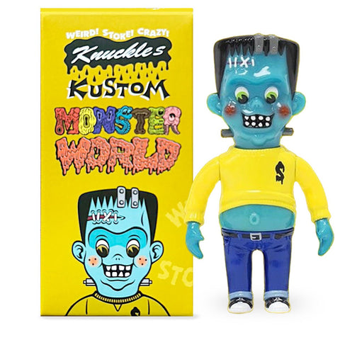 A toy figure resembling Frankenstein's monster with a bright blue face and yellow shirt stands next to its yellow packaging labeled "Monster World — Knuckle’s Kustom Blind Box" by How2Work (HK).