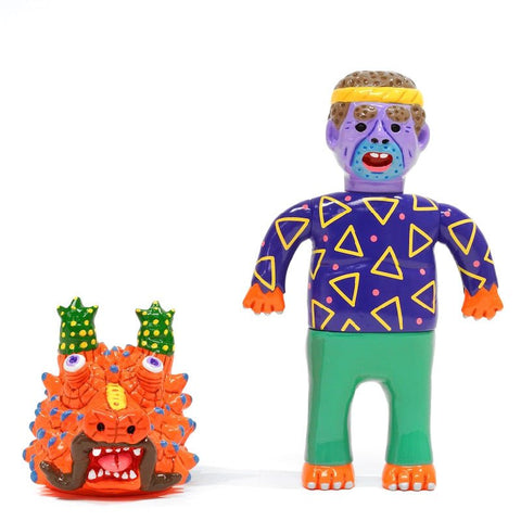 Two colorful toy figures: one resembling a purple-skinned person with green pants and a purple shirt with yellow triangles, and the other an About Animals Motoyoshi Taiga — Dragon 1st Version by Paradise Toy (TW).