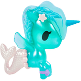 Introducing the Magical Tides Mermicorno Tokidoki by tokidoki—a whimsical turquoise toy figure blending unicorn and mermaid features. Adorned with a star on its head, a blue horn, shimmering mermaid tail, and delicate beads around its body, this figure enchants with black eyes and soft pastel hues. Radiating ocean-inspired charm, it’s perfect for fans of underwater adventures and collectors of the magical Mermicorno Blind Box series.