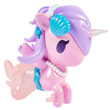 Meet the Magical Tides Mermicorno Tokidoki by tokidoki—a pastel pink and purple toy unicorn with a shimmering mermaid tail, blue seashell accessory, pearl necklace, and a glimmering horn. Styled with large cartoon eyes and whimsical fins, this enchanting figure is the perfect companion for imaginative underwater adventures. Every magical detail of this Mermicorno Blind Box radiates ocean-inspired charm!.