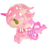 A glossy pink toy figure from tokidoki’s Magical Tides Electra Mermicorno Special Edition, featuring a unique unicorn-mermaid design with a horn, fin-like wings, green eyes, and a mermaid fishtail.