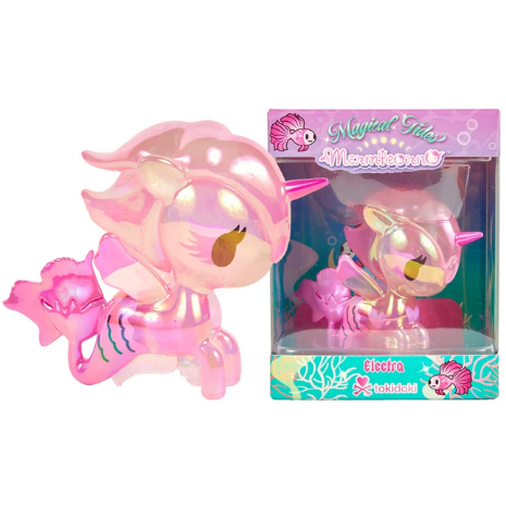 A shiny pink Magical Tides Electra Mermicorno Special Edition toy with golden eyes is displayed next to its colorful box labeled “Electra” from tokidoki.