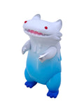 The Little Hut (HK)’s Byron — Mt. Fuji is a blue-and-white plastic toy figure with red eyes, sharp teeth, small arms, and large feet—an upright tribute to contemporary Kaiju art inspired by Shoko Nakazawa’s iconic monster.