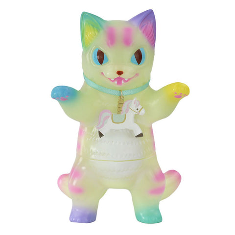 The Konatsuya (JP) Negora — Carousel V2 (Glow) is a pastel translucent cat figurine with rainbow accents, upright paws, and a white horse charm on a blue necklace.