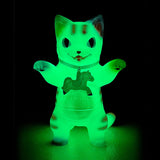 The Konatsuya (JP) Negora — Carousel V2 (Glow) figurine, featuring a glowing green kitty with a horse necklace and raised arms, stands upright against a black background.