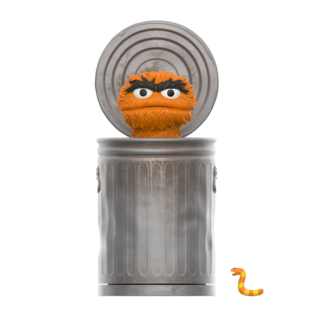 A furry orange character peeks from a metallic trash can with an open lid, while a small, orange-striped worm is near the can's bottom—a perfect scene for any Sesame Street Series 1 Super 7 Blind Box enthusiast.