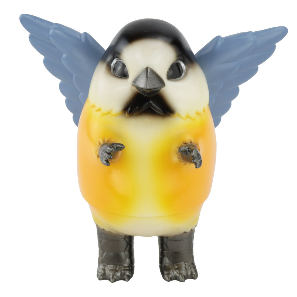 The Pigora — Varied Tit, a stylized bird kaiju toy figure created by the Japanese artist Konatsu, features blue wings, an orange-yellow body, and clawed feet. It is shown against a white background.