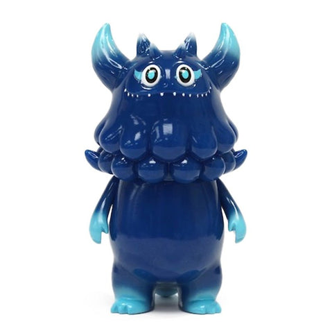 A Rangeas Jr. — Night Sky figurine from The Little Hut (HK) stands upright. The figure has a wide grin, large eyes, and two-toned blue coloring.