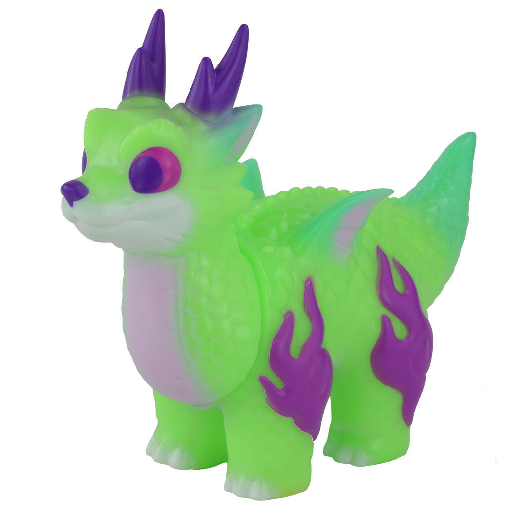 A small, green dragon-like figurine with purple horns, purple flames on its sides, and large pink eyes. The glow-in-the-dark delight is a must-have for fans of Konatsuya's (JP) Ryudora — Shine Dragon series.