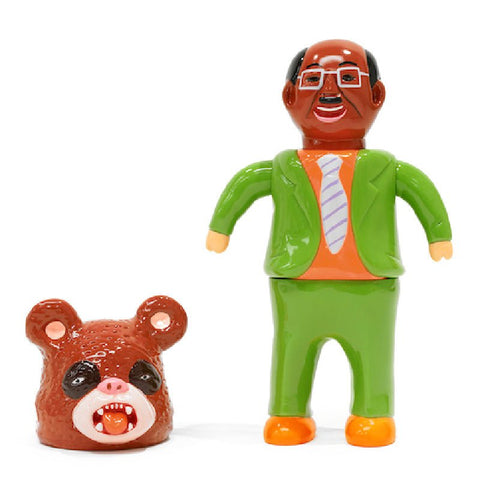 A toy figure dressed in a green suit and glasses, standing next to a detached head of a bear with its mouth open. The product is About Animals Satoshi Yamamoto—Panda 2nd by Paradise Toy (TW).